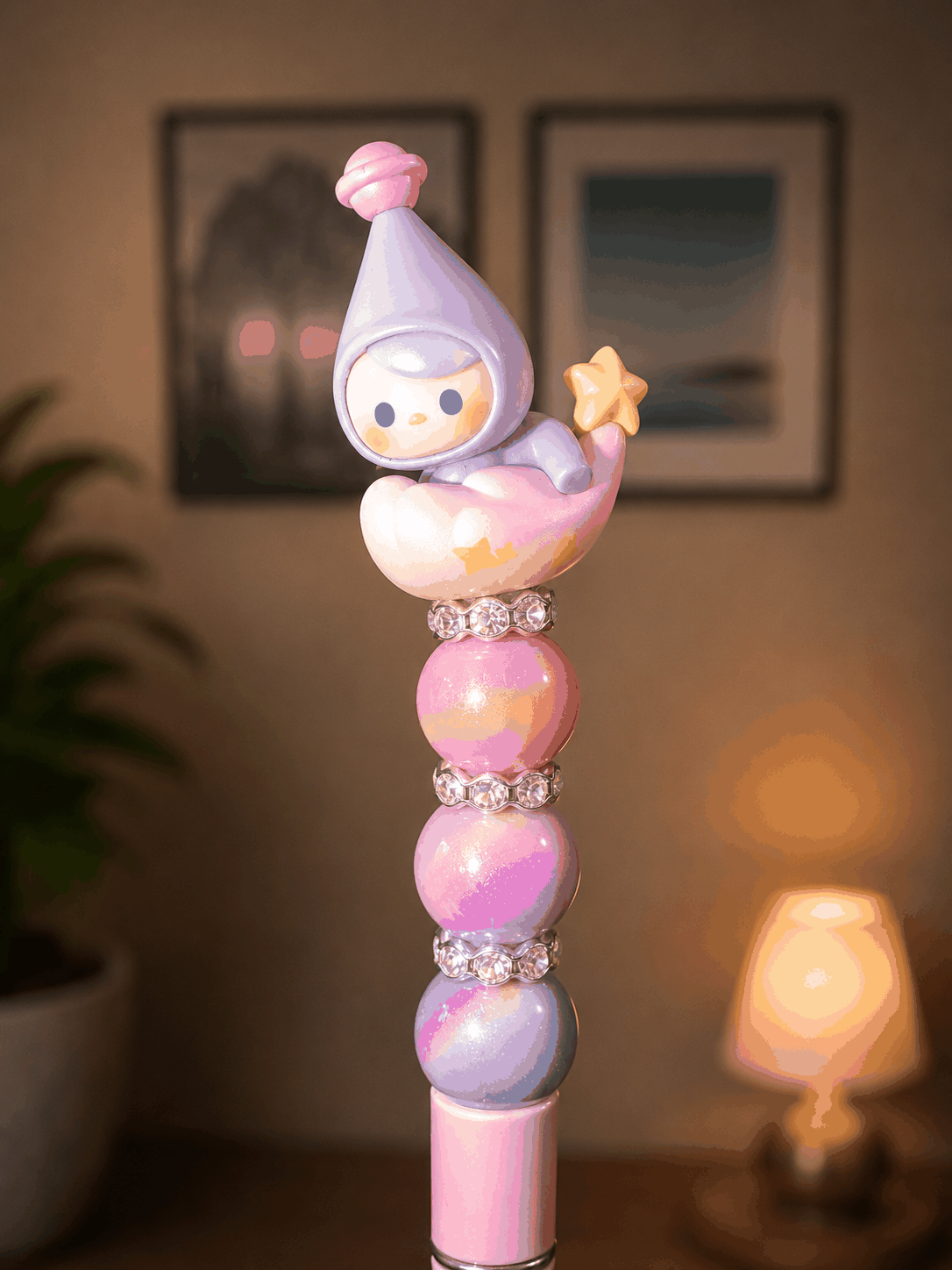 Handmade beaded pen featuring an authentic POP MART Pucky Goodnight collectible topper sitting on a crescent moon cloud with a star accent, decorated with pastel pink, lavender, and purple beads and sparkling rhinestone spacers.