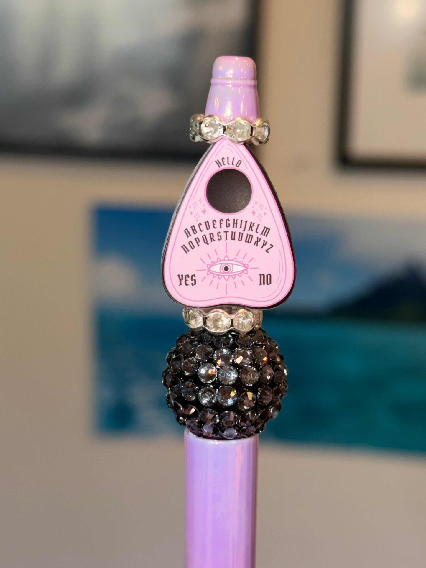 Handmade pastel goth Ouija beaded pen with pink planchette charm and black rhinestone bead on lavender barrel