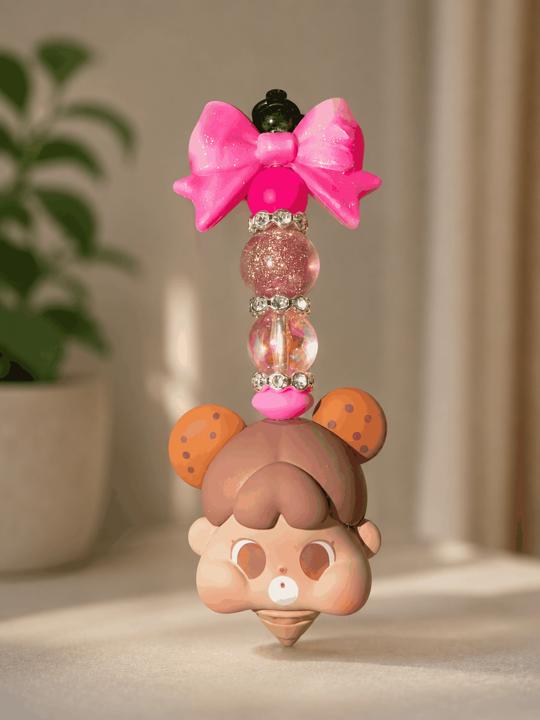 Handmade kawaii bag charm featuring a cute ice cream baby character, glitter pink bow, iridescent beads, and rhinestone spacers displayed against a soft neutral background.