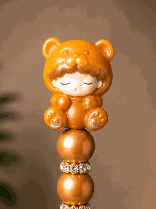 Authentic YUMO Gummy Bear Bean Beaded Pen with caramel beads and black textured barrel for journaling and office use
