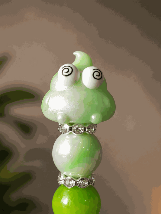 Cute green kawaii poop beaded pen with spiral-eyed character and rhinestone accents for school and office use