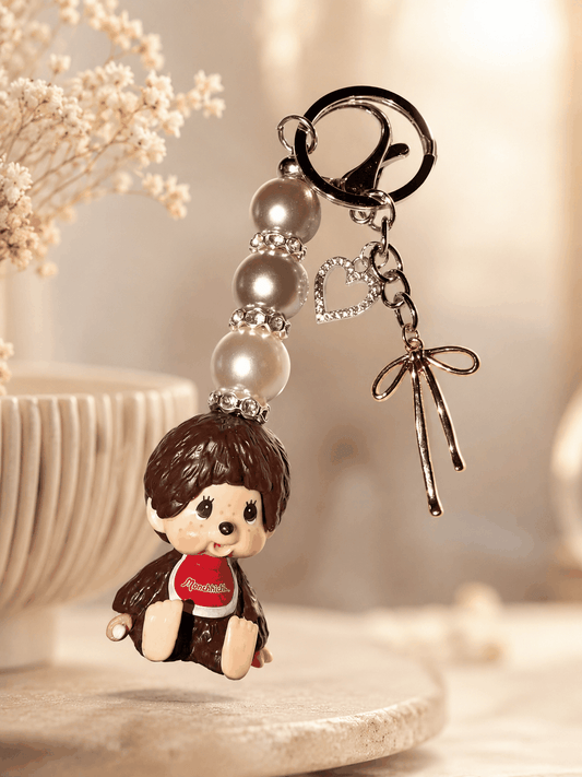 Authentic Monchhichi beaded bag charm with pearl beads, rhinestone spacers, silver heart, and bow charms on keychain