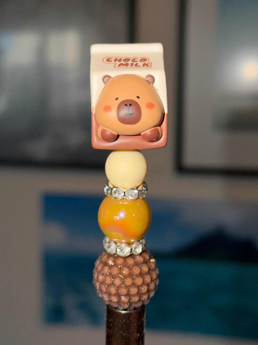 Choco Milk Capybara kawaii beaded pen with bear topper and rhinestones on warm-toned bead stack