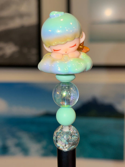 Dreamy Cloud Girl beaded pen with sleeping figure topper on mint aurora beads and glitter accents