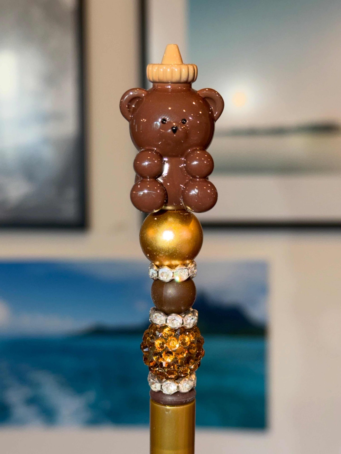 Kawaii Honey Bear Beaded Pen with brown bear topper holding honey bottle on gold and rhinestone embellished barrel
