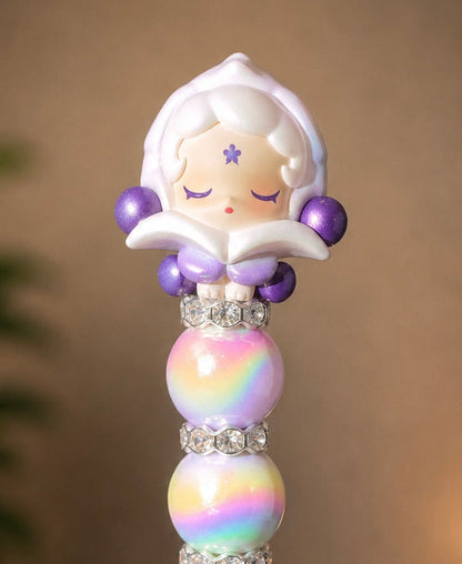 Authentic Skullpanda Pop Bean beaded pen with collectible topper, rainbow beads, lavender accents, and pearl crystal barrel for kawaii journaling