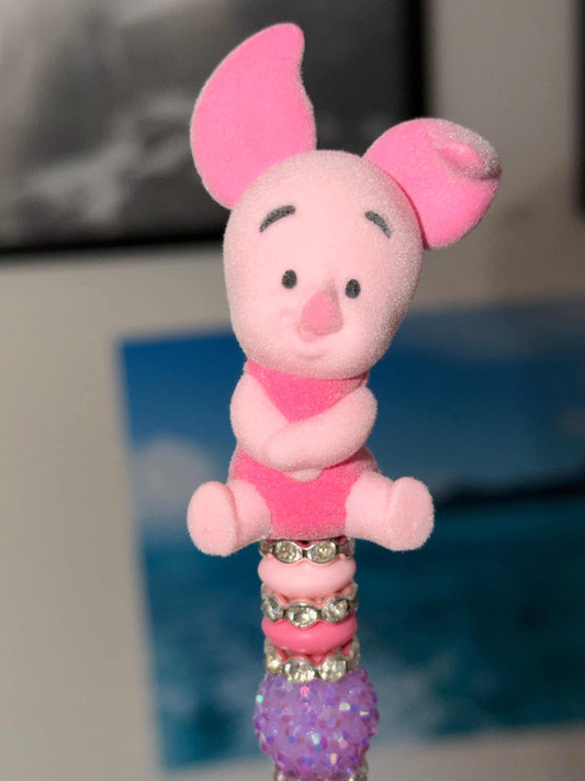 Handmade pink beaded pen with authentic Piglet Bean figure topper and sparkling rhinestone accents