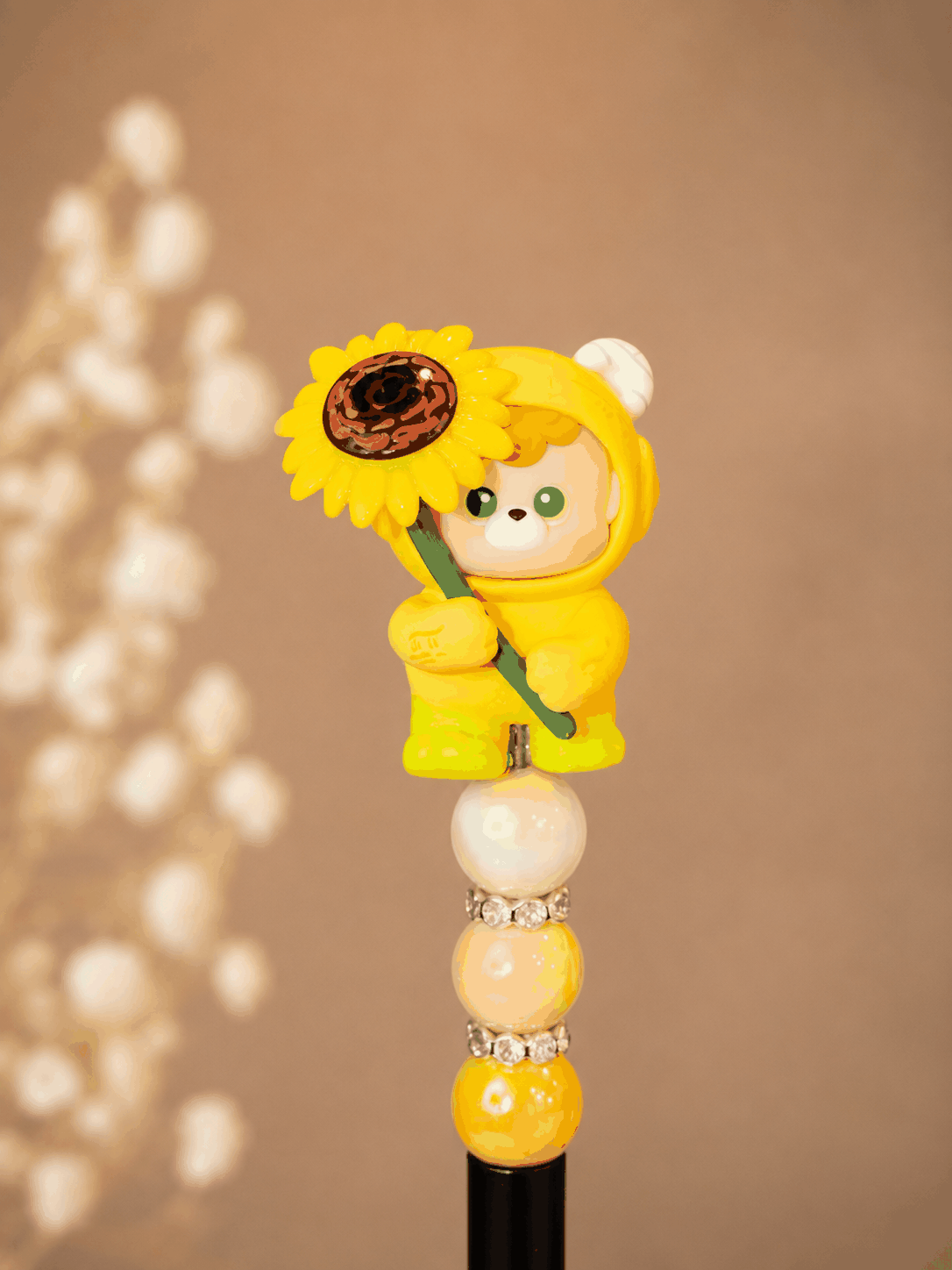 Handmade Sunflower Pop Bean Beaded Pen with cute character topper, yellow pearl beads, rhinestone accents, and smooth black ink