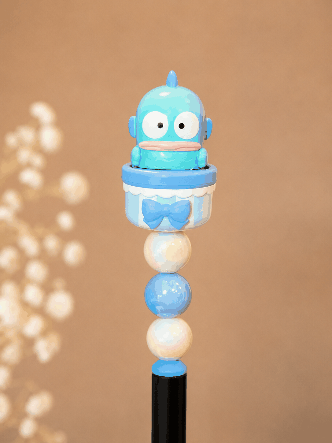 Fish Man Sanrio beaded pen with blue character and pastel cup topper