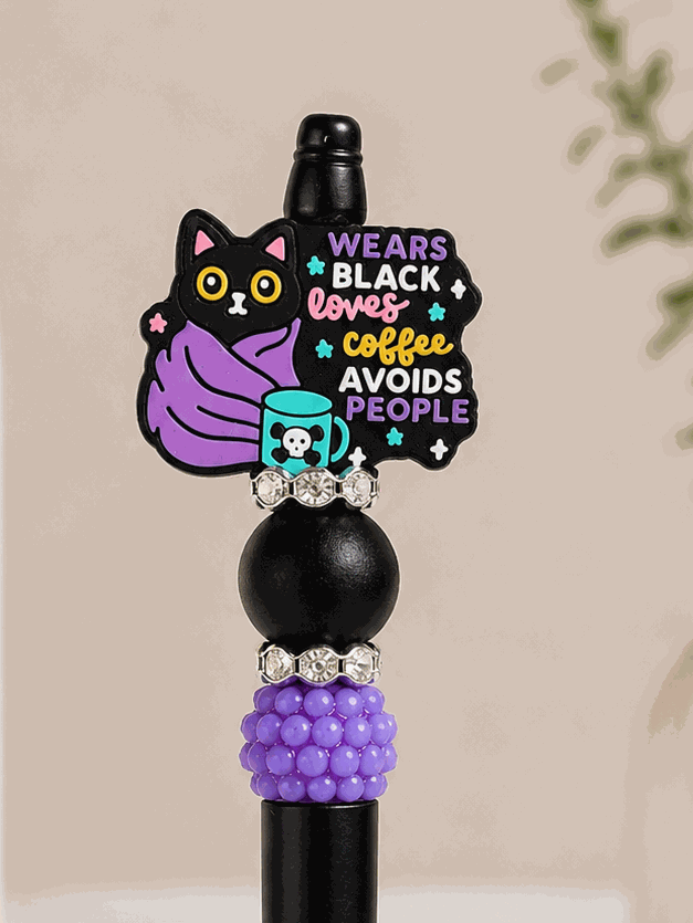Black and purple beaded pen with black cat bead and coffee lover quote