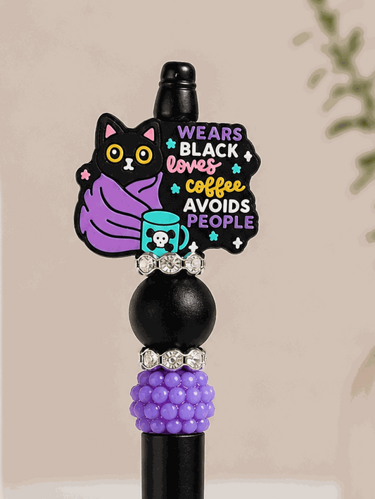 Black and purple beaded pen with black cat bead and coffee lover quote