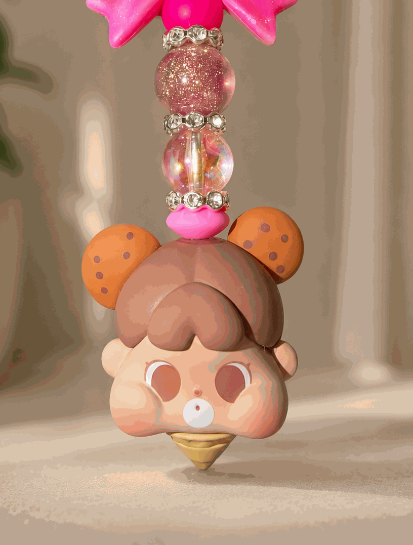 Handmade kawaii bag charm featuring a cute ice cream baby character, glitter pink bow, iridescent beads, and rhinestone spacers displayed against a soft neutral background.