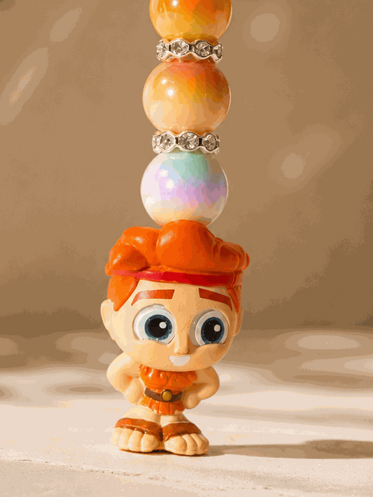 Authentic Disney Hercules Doorable keychain featuring a Hercules character charm with orange and gold beads, iridescent accents, rhinestone spacers, and a silver keyring displayed on a professional neutral background.