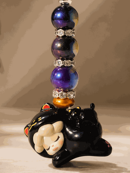 
Authentic Wendy bean bag charm keychain featuring a sleeping Wendy character charm, purple galaxy-inspired beads, rhinestone spacers, bronze accents, and a silver keyring displayed on a professional neutral background.