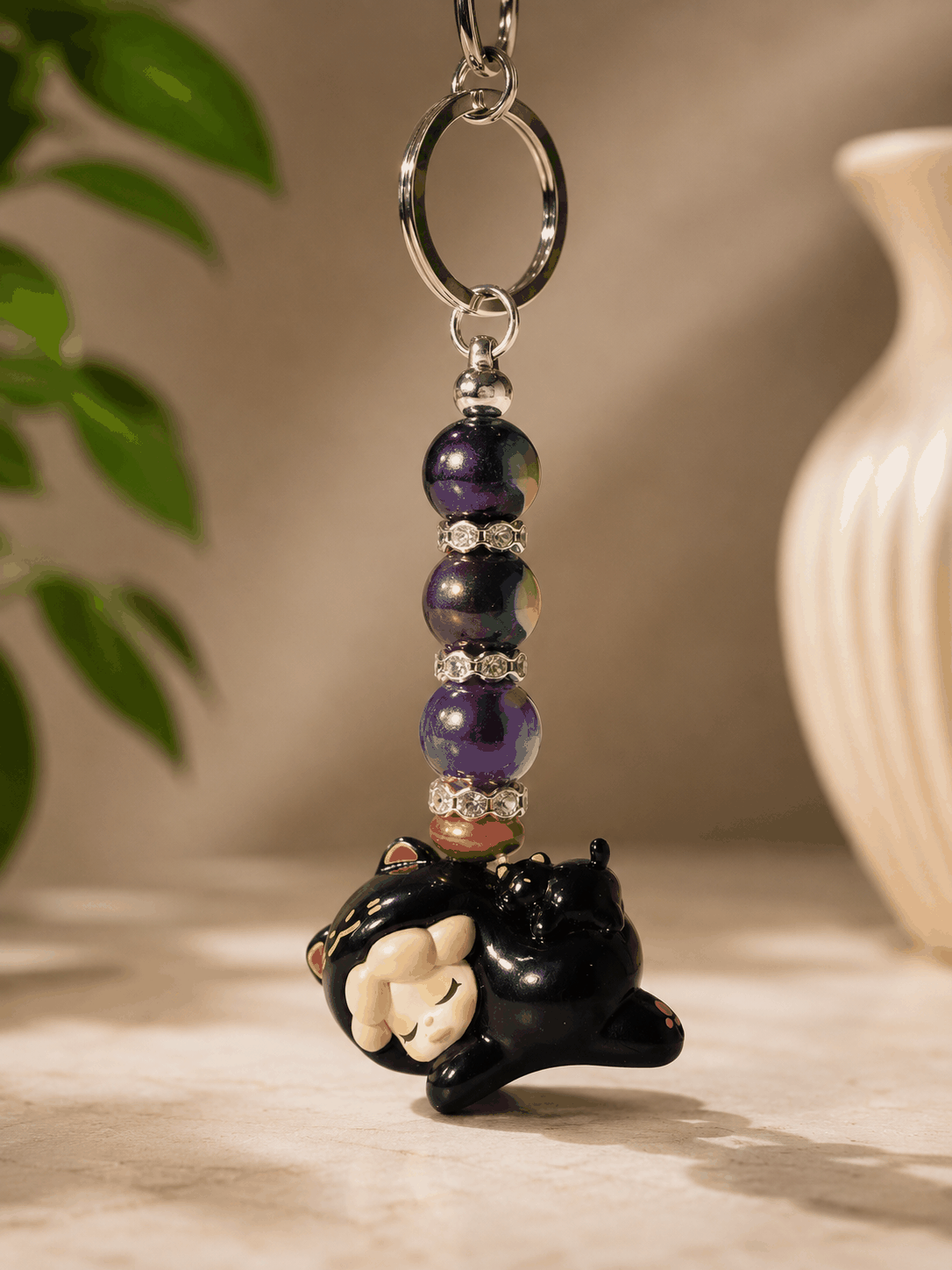 Authentic Wendy bean bag charm keychain featuring a sleeping Wendy character charm, purple galaxy-inspired beads, rhinestone spacers, bronze accents, and a silver keyring displayed on a professional neutral background.