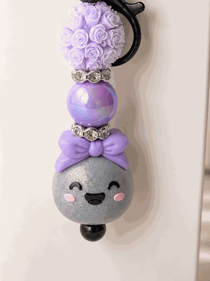 Handmade Glitter Dumpling Beaded Keychain Charm with iridescent beads and floral accents for cute purse and backpack accessory
