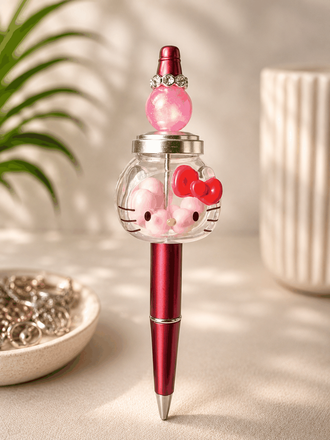 Hello Kitty shaker bean topper pen with pink beads and metallic berry pink barrel