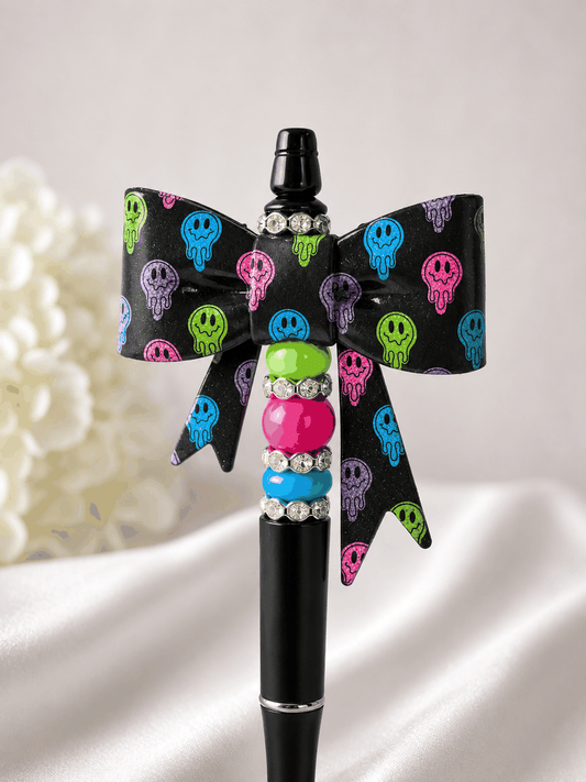 Drip Smiley Face Beaded Pen with neon Y2K bow and groovy smile, edgy desk accessory gift for her