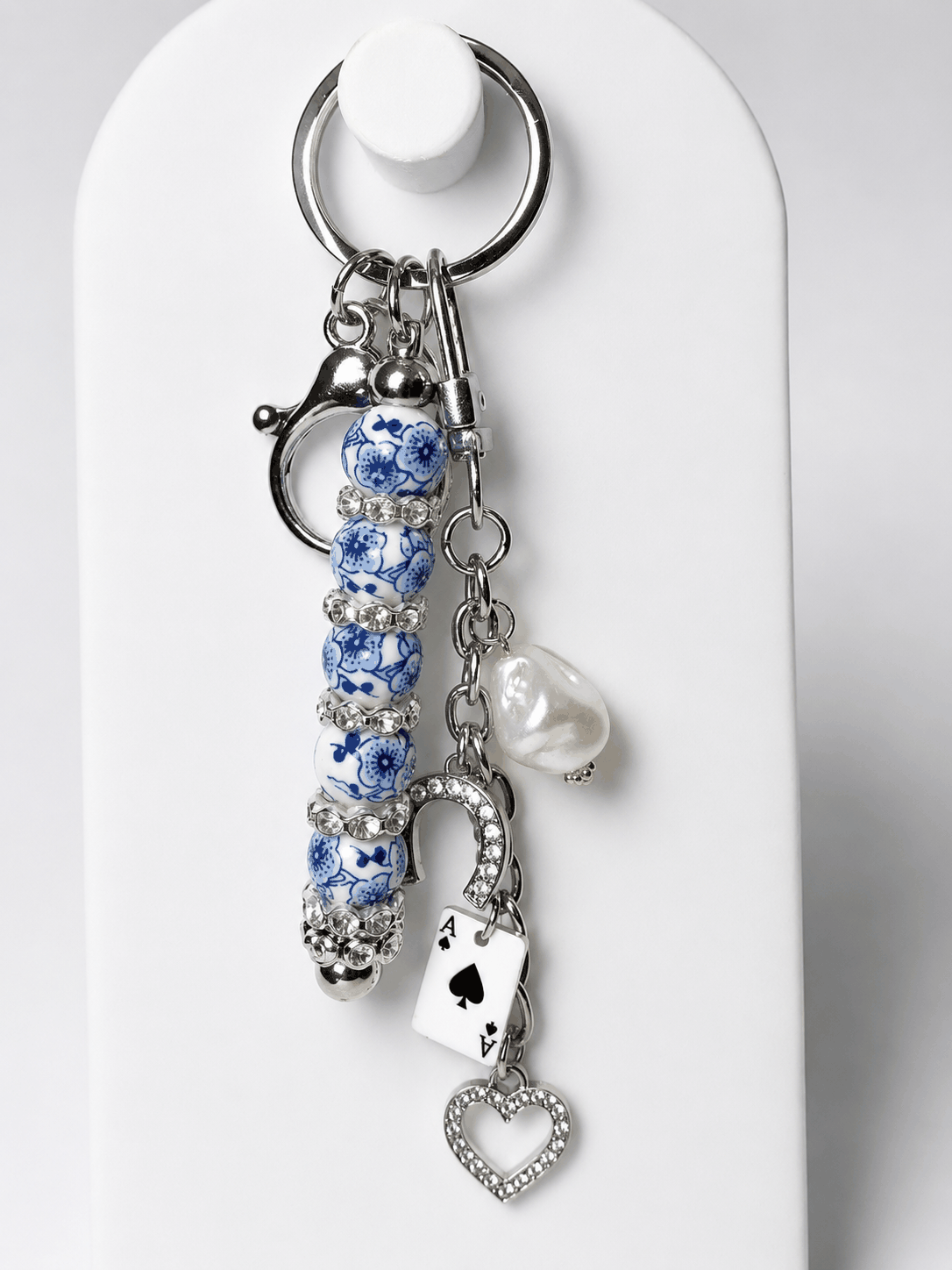 Blue and white porcelain inspired beaded bag charm keychain with horseshoe, Ace of Spades, rhinestones, and freshwater pearl