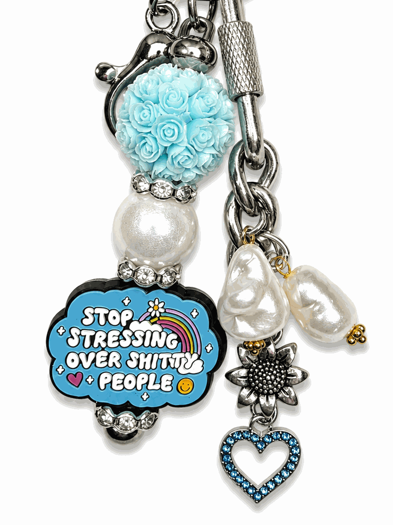 Funny motivational bag charm with freshwater pearls, blue crystal heart, and humorous statement charm.