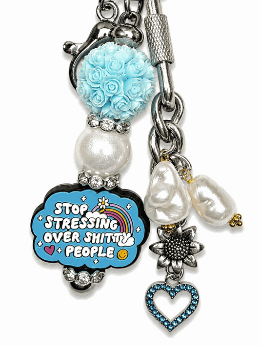 Funny motivational bag charm with freshwater pearls, blue crystal heart, and humorous statement charm.